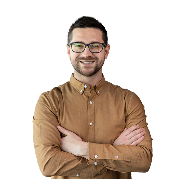 a man smiling in front of the camera